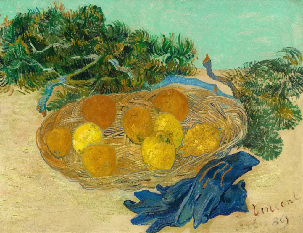 Still life painting of oranges and lemons in a basket beside a pair of blue gloves